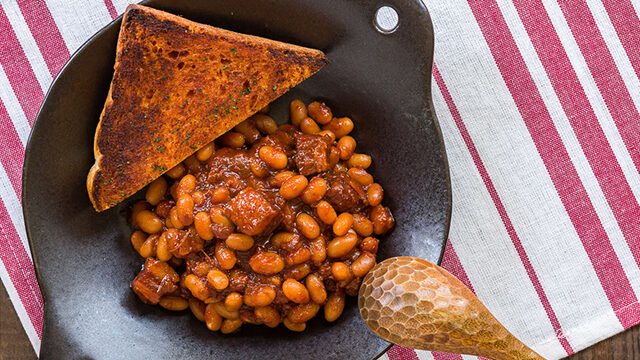 The Kimchi Baked Beans are the perfect blend of sweet and savory, a Korean twist on a classic dish.