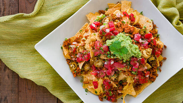 Loaded Vegan Nachos are the way to make your favorite Mexican dish healthy.